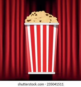 red curtain and popcorn box
