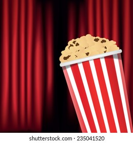 red curtain and popcorn box