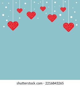 Red decorative hanging hearts on blue background with copy space. Happy Valentine's Day celebration