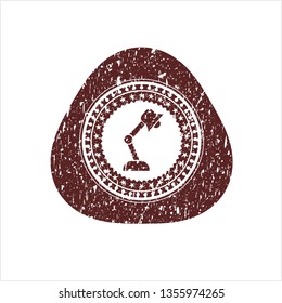 Red desk lamp icon inside distress rubber stamp with grunge texture
