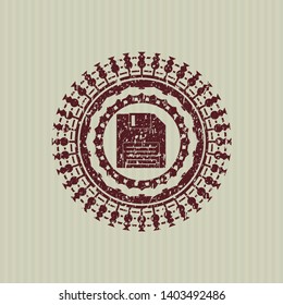 Red diskette icon inside distress rubber grunge texture seal