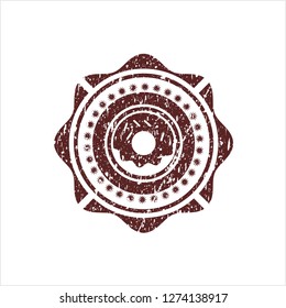 Red donut icon inside distressed rubber texture