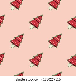 Red dotted new year cookies seamless pattern. Fir tree winter silhouettes on light pink background. Perfect for wallpaper, textile, wrapping paper, fabric print. Vector illustration.