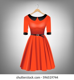 Red dress with black collar and belt on hanger
