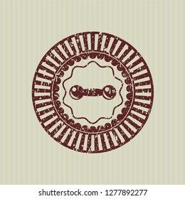 Red dumbbell icon inside distress rubber stamp