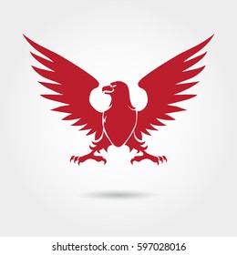 Red eagle heraldic style silhouette. Vector eagle logo design