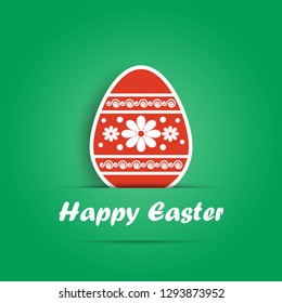 red Easter egg with patterns on green background