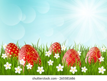 Red Easter eggs on green grass
