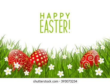 Red Easter eggs on green grass