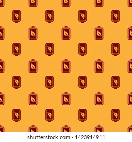 Red Eco nature leaf and battery icon isolated seamless pattern on brown background. Energy based on ecology saving concept. Vector Illustration