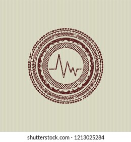 Red electrocardiogram icon inside grunge seal