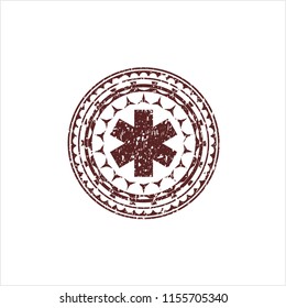 Red emergency cross icon inside grunge seal