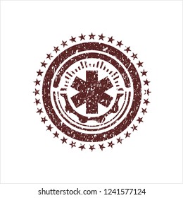 Red emergency cross icon inside distress rubber grunge texture stamp