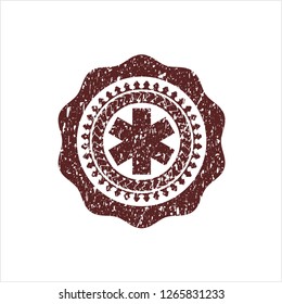 Red emergency cross icon inside distress rubber seal