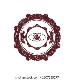 Red eye icon inside distressed rubber grunge texture seal