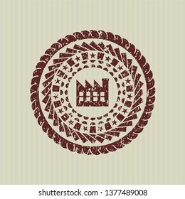 Red factory icon inside rubber texture