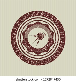 Red fertilization icon inside grunge seal