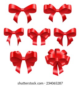 Red festive bows. Beautiful bright ribbons of different configurations. Suitable as a decoration for the holidays, such as Christmas for example.