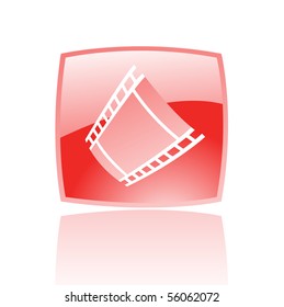 Red film reel in red glass button isolated on white