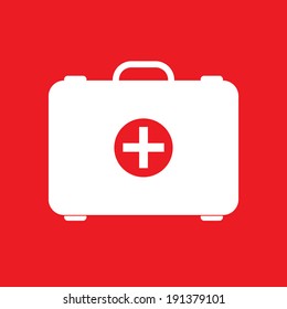 Red first aid box on red background