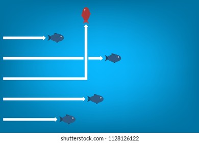 Red fish changing direction and blue ones. New idea, change, trend, courage, creative solution, innovation and unique way concept.