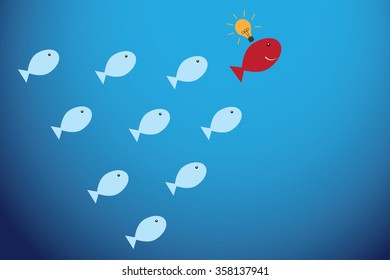 red fish with light bulb and blue fishes, leadership and business concept