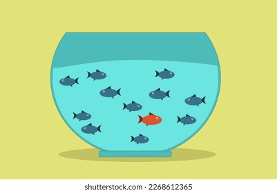 Red fish surrounded by blue fishes in the auvarium.