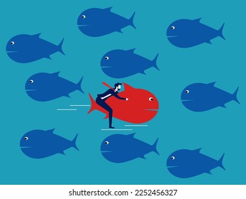 Los peces rojos nadan en la dirección opuesta a los otros peces. Valor y confianza. diferencia comercial