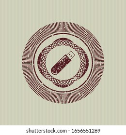 Icono de la unidad flash roja dentro del sello de goma con textura gruesa
