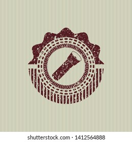Red flashlight icon inside distress rubber texture
