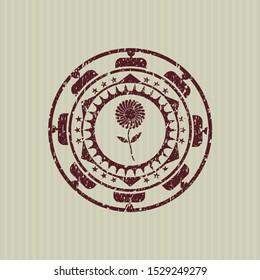 Red flower icon inside distress rubber seal with grunge texture