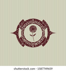 Red flower icon inside rubber stamp with grunge texture