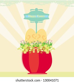 Red flowerpot with green grass and easter eggs