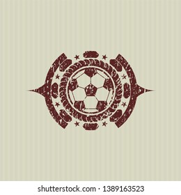 Red football ball icon inside rubber stamp with grunge texture