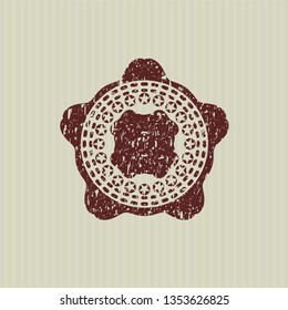 Red four leaf clover icon inside distress rubber grunge texture stamp