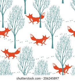 Red foxes in a winter forest background