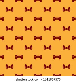 Red Gamepad icon isolated seamless pattern on brown background. Game controller.  Vector Illustration