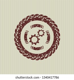 Red gear, team work icon inside grunge stamp