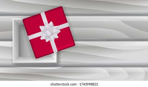 Red gift box with bow on a wooden board. Vector stock illustration for poster