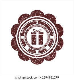 Red gift box icon inside rubber grunge seal