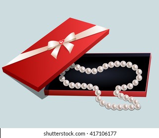 Red gift box with a pearl necklace on gray background