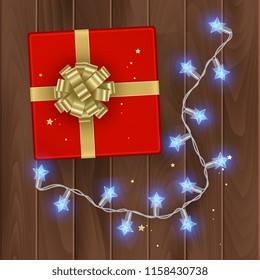 Red gift box, top view, gift box on wooden background with golden bow, vector illustration