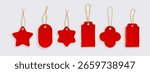 Red gift tags with gold string hanging loops - festive shapes of star and cross, oval and rectangle designs. Blank price labels for Christmas presents, retail merchandise or holiday decorations.