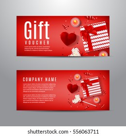 Red gift voucher for Valentine's Day. Unusual design of coupon usable for invitation and ticket. Top view on gift box, red case for ring, candles, confetti and serpentine.