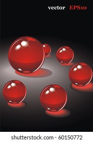 The red glass balls on a black background. Vector illustration for your design