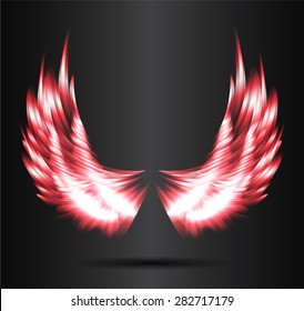 red glowing, stylized angel wings on a black background. vector