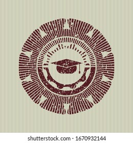 Red graduation cap icon inside rubber grunge texture stamp