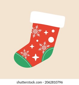 Red and green Christmas sock decorated with a pattern. Empty christmas stocking with fur and patches isolated on white