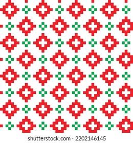 Red and green cross-stitch knitting pattern on white background. Red and green square dots on white backdrop. Christmas color theme fabric pattern design for sale. Knitting handicraft art.
