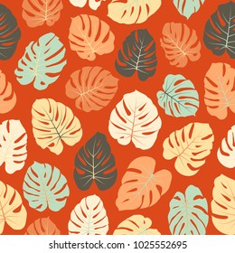 Red and green floral jungle ornament with monstera leaf tropical seamless pattern vector.  Philodendron or monstera plant background. Tropical pattern with jungle leaves decor, seamless background.